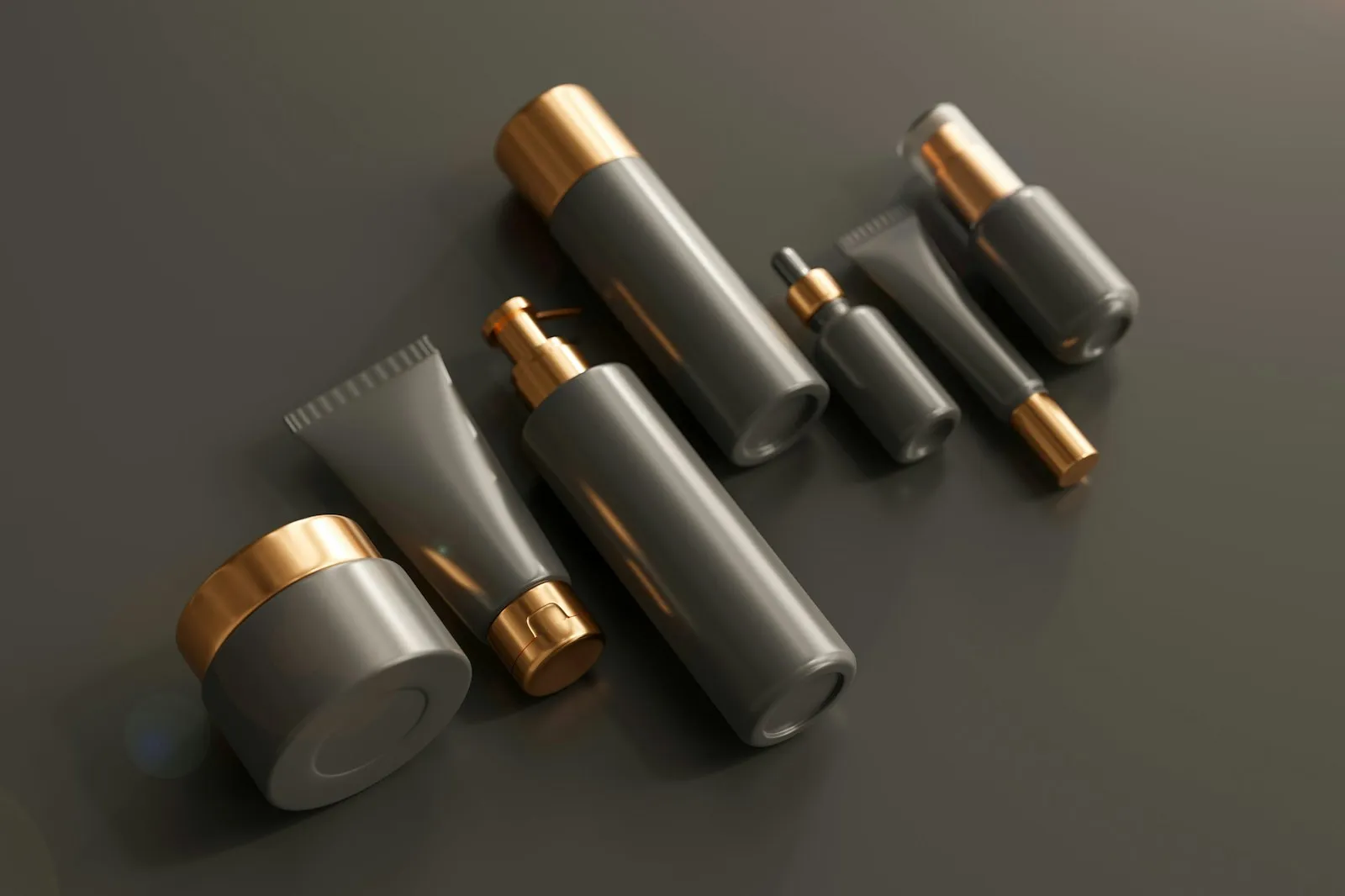 Unbranded skincare bottles, pump, tube and jar on a dark surface for Alaikas.com beauty guides