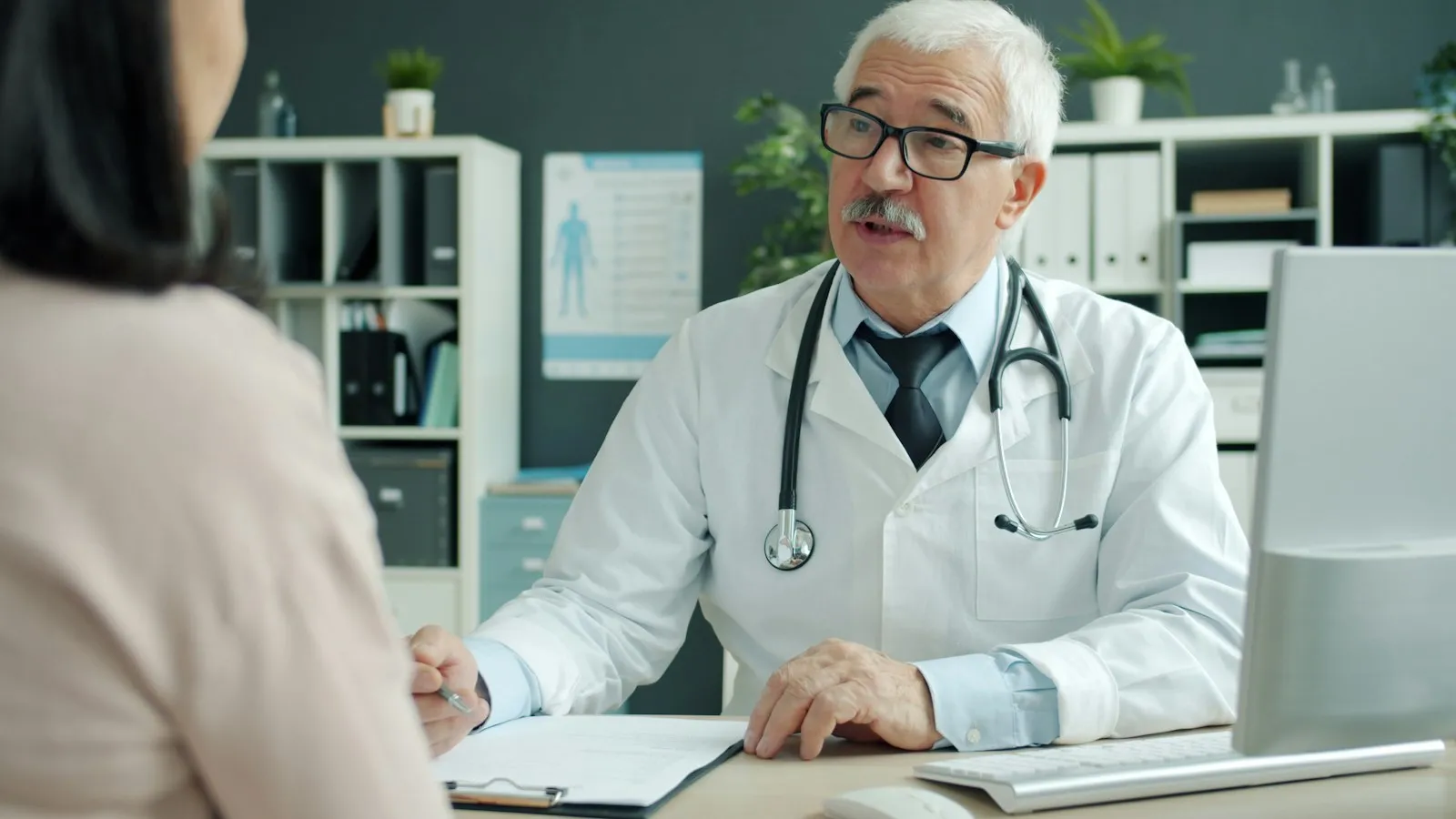 Doctor discussing health concerns and care options with a patient during a consultation